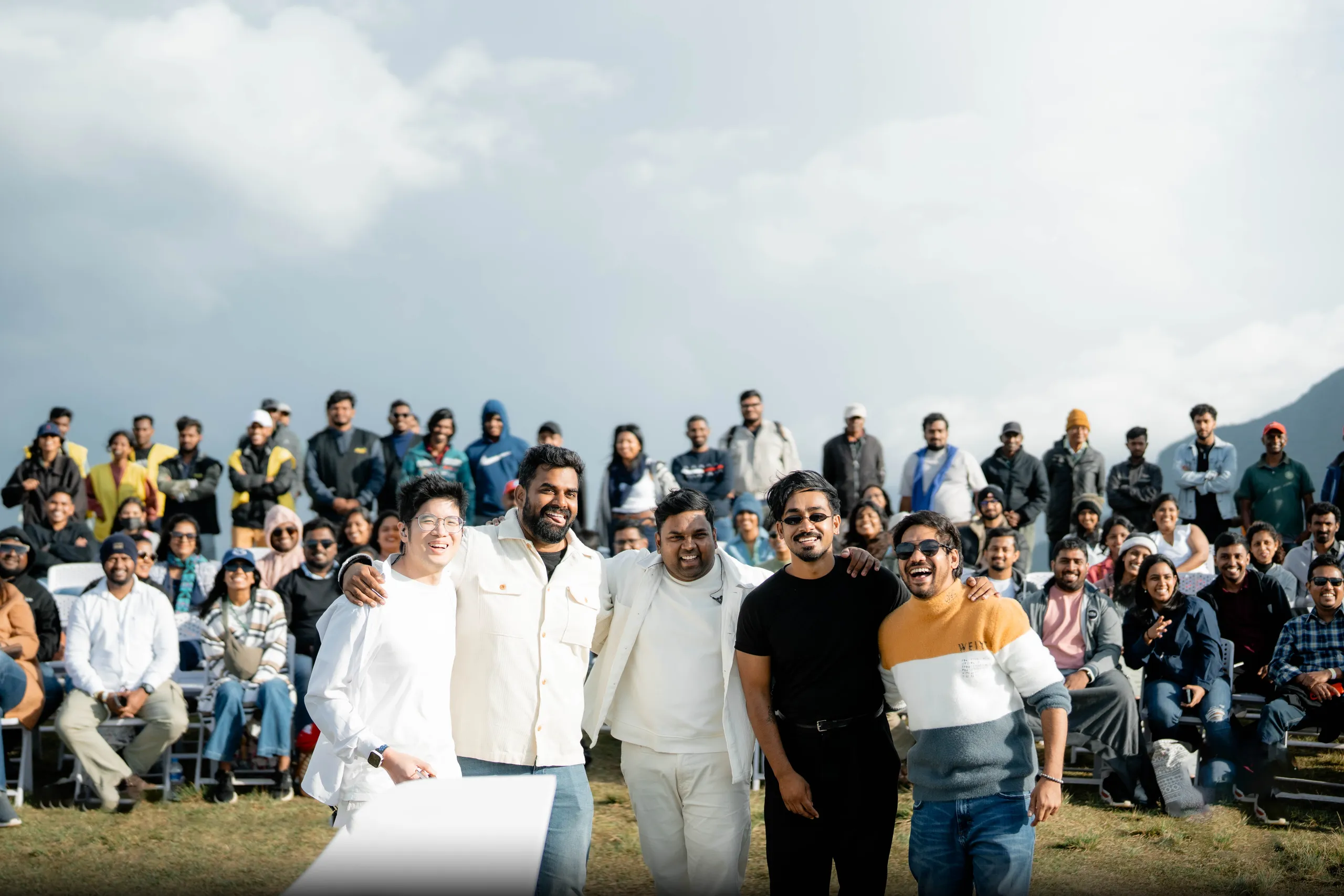 Artists laughing in front of the audience